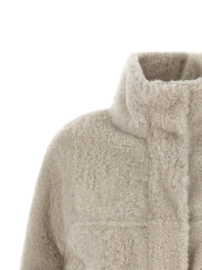Overcoat by Brunello Cucinelli for women in lamb leather beige & natural features an satoral silhouette, showcasing a sophisticated high-neck neckline and satoral pockets for a premium, timeless look.
