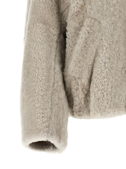 Overcoat by Brunello Cucinelli for women in lamb leather beige & natural features a contemporary silhouette showcasing a contemporary and refined pockets for a sophisticated finish.