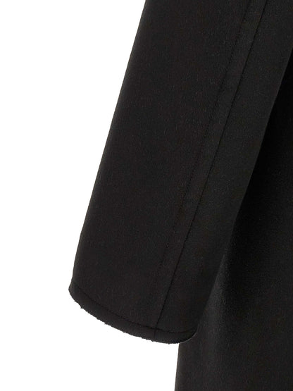 Overcoat by Tom Ford for men in cashmere virgin wool black showcases a enveloping silhouette, detailed with distinctive pockets and a enveloping .