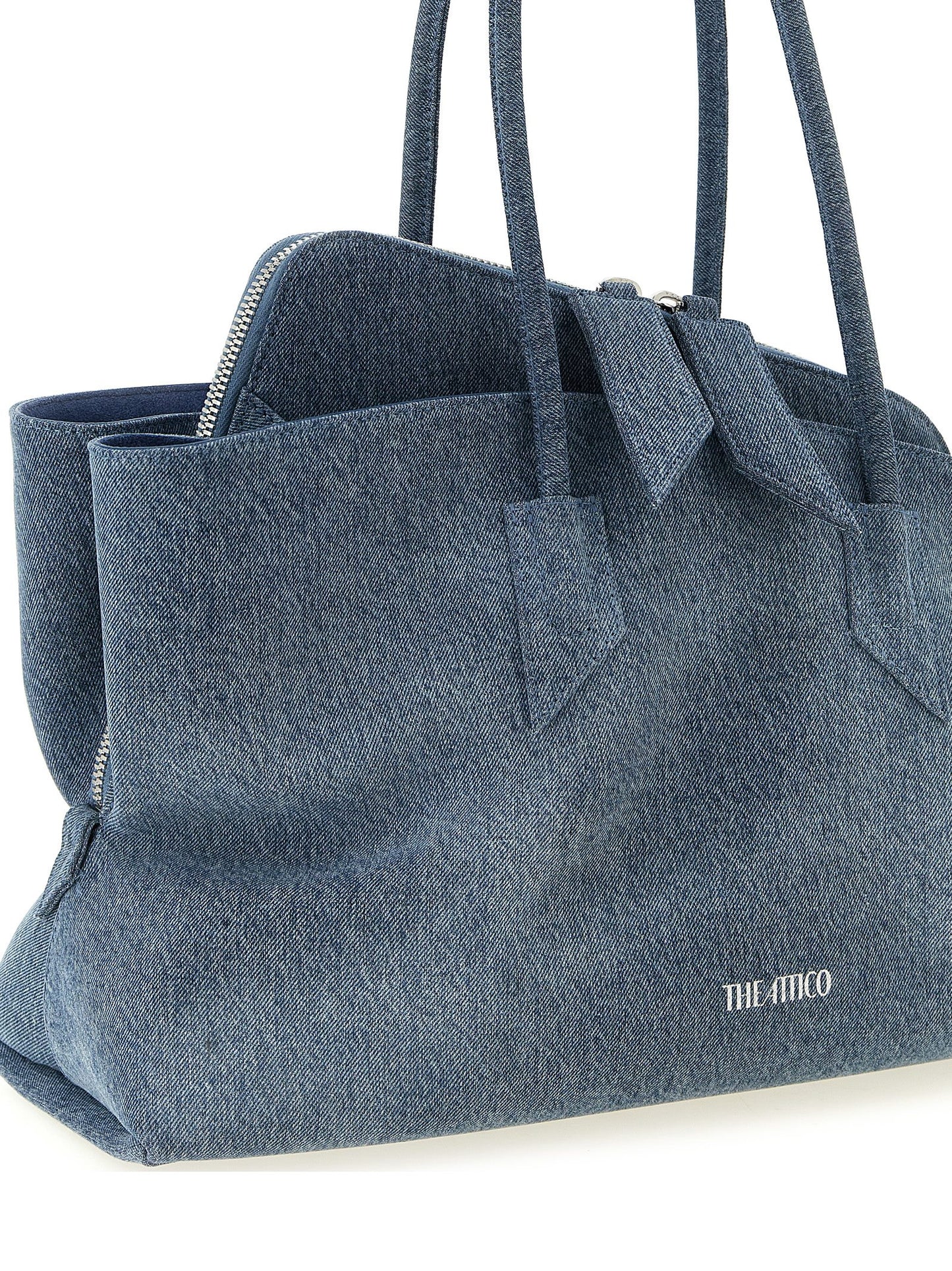 Medium Shoulder Bag by The Attico for women in stretch denim cotton & faux leather blue, silver & print presents a statuesque silhouette, showcasing a secure zipper and statuesque with versatile shoulder-strap & handle for a sophisticated look.