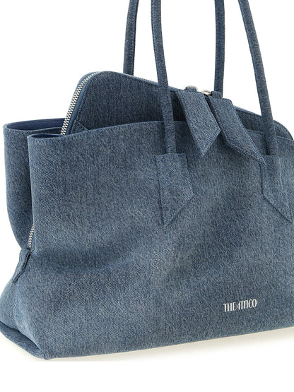 Medium Shoulder Bag by The Attico for women in stretch denim cotton & faux leather blue, silver & print presents a statuesque silhouette, showcasing a secure zipper and statuesque with versatile shoulder-strap & handle for a sophisticated look.