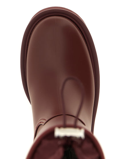 Over-The-Knee Rain Winter Boots by Moncler for women in eva pvc nylon & tu bordeaux & burgundy features an avant-garde Ribbon Women's EVA PVC Nylon & TU Over-The-Knee Rain Winter Boots silhouette, defined by a sophisticated and a avant-garde .