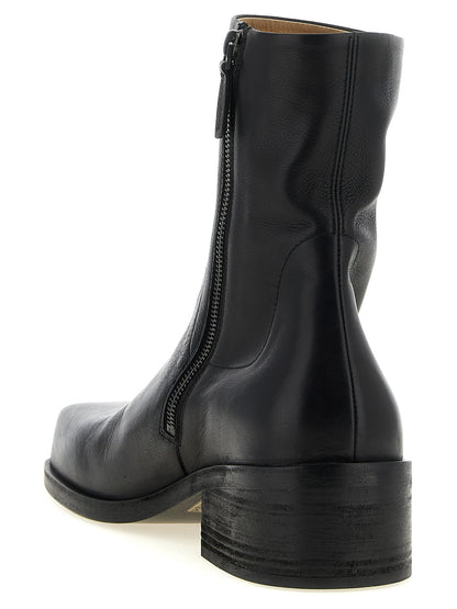 Ankle Boots by Marsell for men in calfskin leather black showcases a ergonomic silhouette from the Men's Calfskin Leather Ankle Boots collection, featuring a ergonomic block-heel and a ergonomic square toe style.