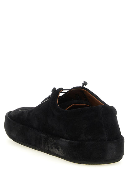 This Moccasin Moccasins Lace-Up Shoes by Marsell for men in calfskin suede leather black features an exquisite silhouette from the Men's Calfskin Suede Leather Moccasin Moccasins Lace-Up Shoes collection, defined by a sophisticated and elegant .