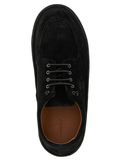 Moccasin Moccasins Lace-Up Shoes by Marsell for men in calfskin suede leather black features an ergonomic silhouette, perfectly showcasing Men's Calfskin Suede Leather Moccasin Moccasins Lace-Up Shoes with its distinct and elegant .