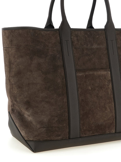 Large Pouch Tote Bag by Tom Ford for men in suede calfskin leather brown & silver features an sumptuous T Bar Suede Calfskin Leather Large Pouch Tote Bag design with a secure , ample , and versatile handle for an sumptuous finish.