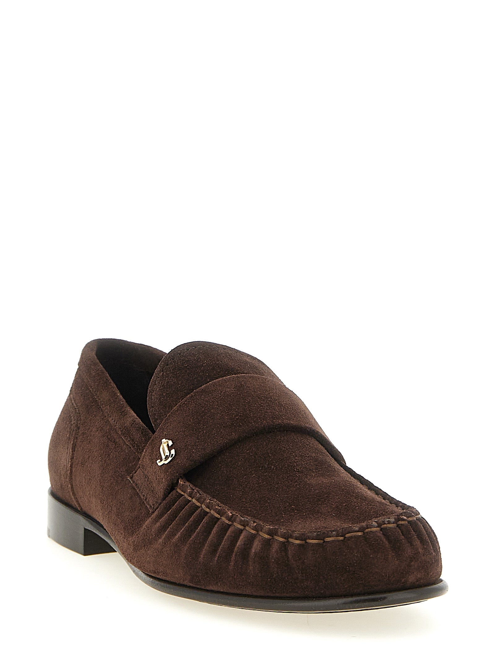 Flat Moccasin Moccasins Loafer Slip-On Shoes by Jimmy Choo for women in suede leather brown, gold & monogram features an effortless chic silhouette, showcasing the Women's Suede Leather Flat Moccasin Moccasins Loafer Slip-On Shoes design with an effortless chic flat and a for a effortless chic look.
