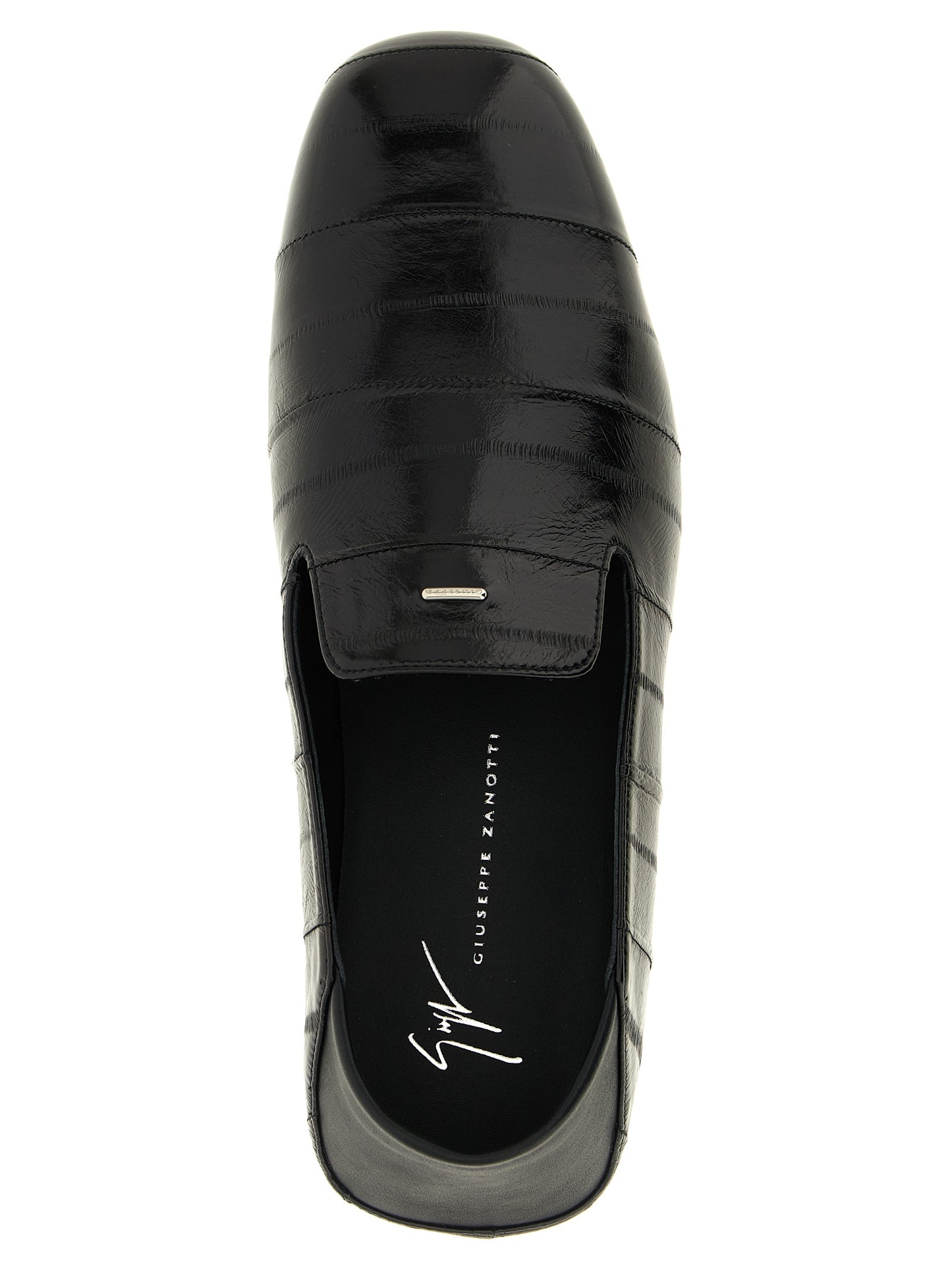 Flat Loafer Slip-On Shoes by Giuseppe Zanotti for men in eel leather black & silver showcases a impeccable silhouette as Men's Eel Leather Flat Loafer Slip-On Shoes, artfully designed with a impeccable flat and refined for a impeccable finish.