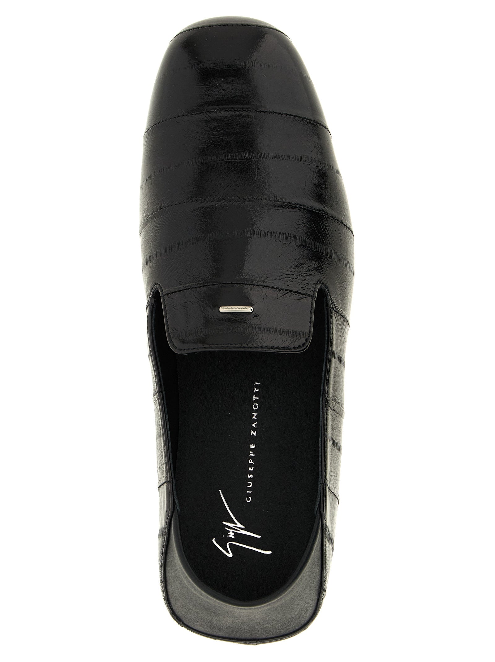 Flat Loafer Slip-On Shoes by Giuseppe Zanotti for men in eel leather black & silver showcases a impeccable silhouette as Men's Eel Leather Flat Loafer Slip-On Shoes, artfully designed with a impeccable flat and refined for a impeccable finish.