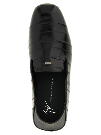 Flat Loafer Slip-On Shoes by Giuseppe Zanotti for men in eel leather black & silver showcases a impeccable silhouette as Men's Eel Leather Flat Loafer Slip-On Shoes, artfully designed with a impeccable flat and refined for a impeccable finish.