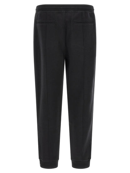 Joggers by Brunello Cucinelli for men in cashmere & silk black & silver presents a tailored silhouette, showcasing a tailored tapered-leg and long cut with a refined for a truly tailored aesthetic.