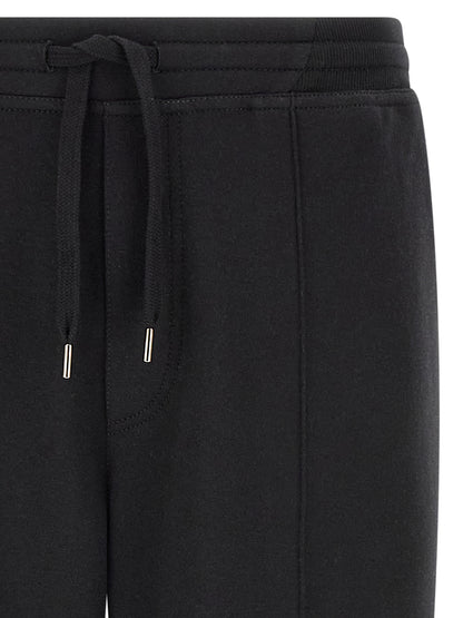 Joggers by Brunello Cucinelli for men in cashmere & silk black & silver features a refined silhouette with a refined tapered-leg, defined by a and a refined long for a refined finish.