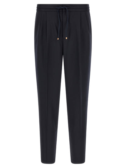 Trousers by Brunello Cucinelli for men in virgin wool & flannel navy features a sculptural silhouette, showcasing a sculptural tapered-leg & relaxed-fit and long with a sophisticated for a sculptural finish.