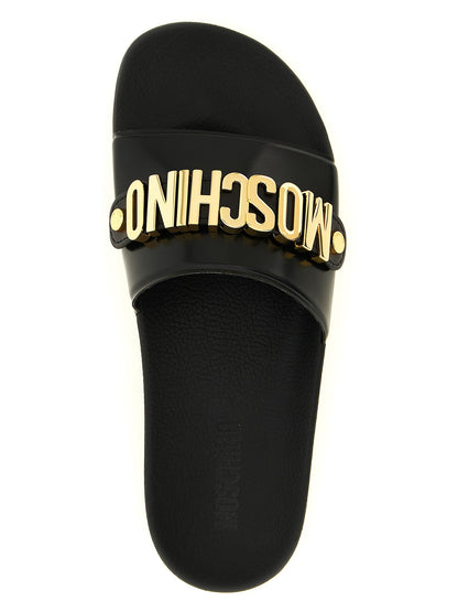 Sliders Sandals Flat Shoes by Moschino for men in pvc gold presents a impeccable silhouette as Men's PVC Sliders Sandals Flat Shoes, artfully designed with a and a impeccable for a refined, upscale finish.