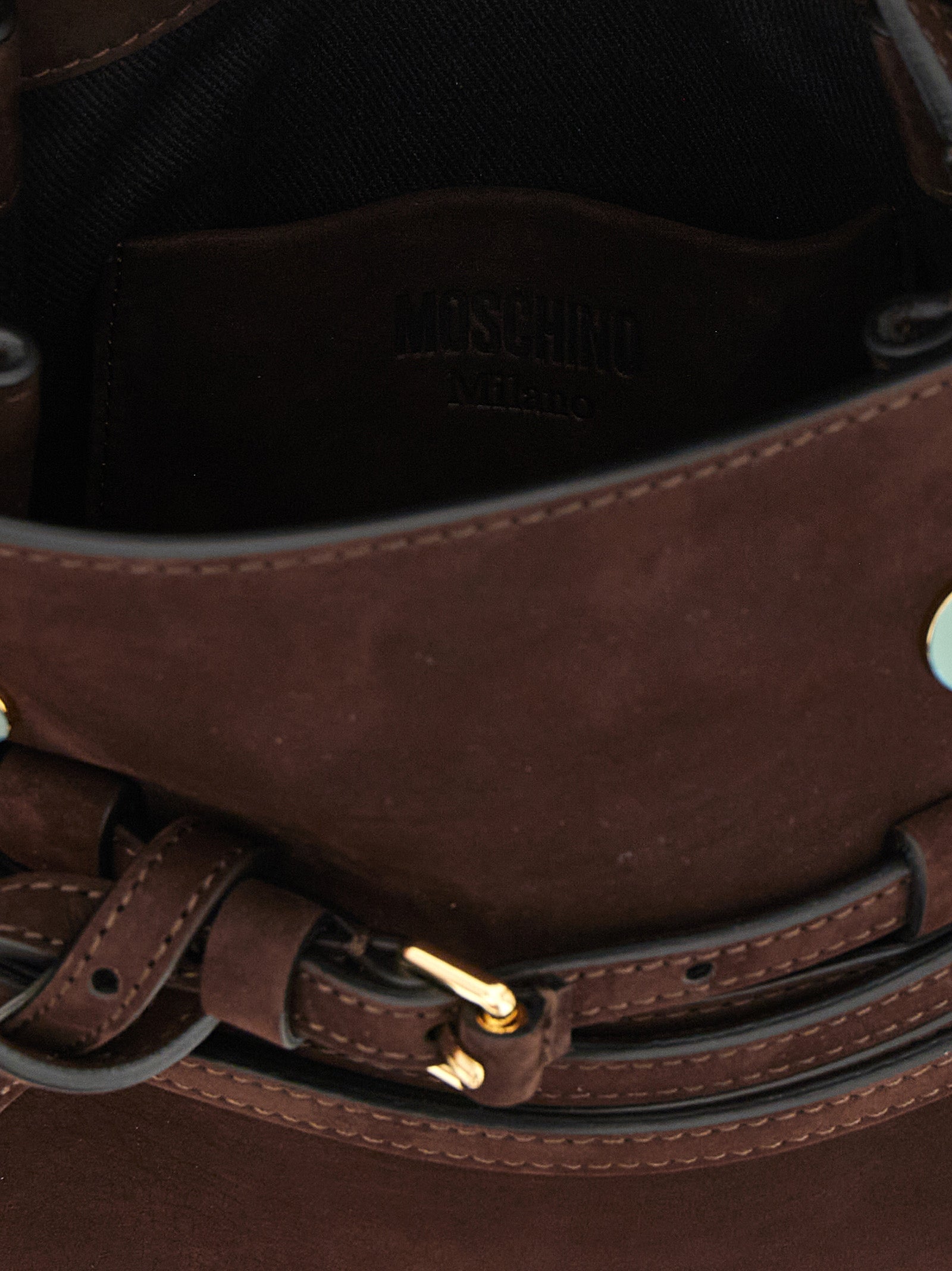 Small Flap Handbag by Moschino for women in calfskin suede leather brown, gold & patterned features an refined silhouette, showcasing a secure flap & buckle, ample , and versatile shoulder-strap, handle, adjustable-strap, detachable-strap & belt-strap for a sophisticated refined aesthetic.