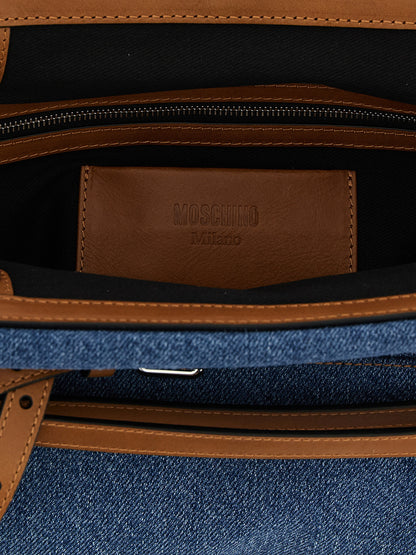 Large Clutch Handbag by Moschino for women in calf leather & cotton blue & silver showcases a sculptural silhouette, featuring a secure zipper, magnetic & buckle, ample internal-pockets, and versatile shoulder-strap, adjustable-strap, detachable-strap & belt-strap for a sculptural finish.