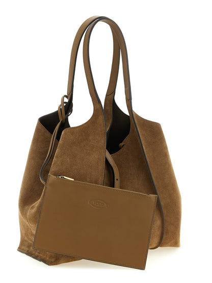 This Shopper Tote Clutch Bag by Tod's for women in calfskin leather & nylon brown & gold features an jet-set T Timeless Calfskin Leather & Nylon Shopper Tote Clutch Bag design with a secure zipper, ample , and jet-set handle.
