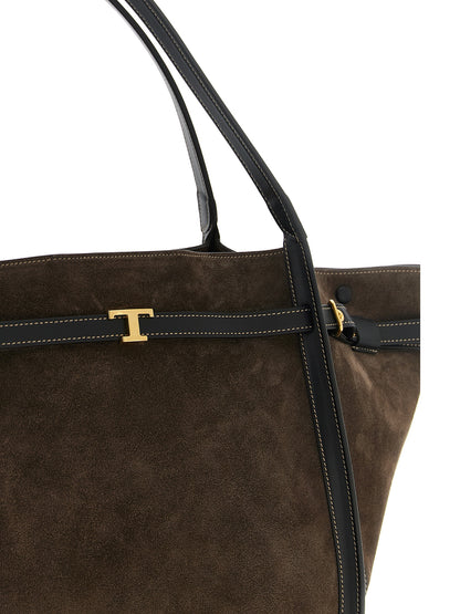 This Shopper Tote Bag by Tod's for women in calfskin leather & nylon brown & gold features an jet-set T Timeless Tim Calfskin Leather & Nylon Shopper Tote Bag design with a secure snap & zipper, ample , and jet-set handle, adjustable-strap & belt-strap.