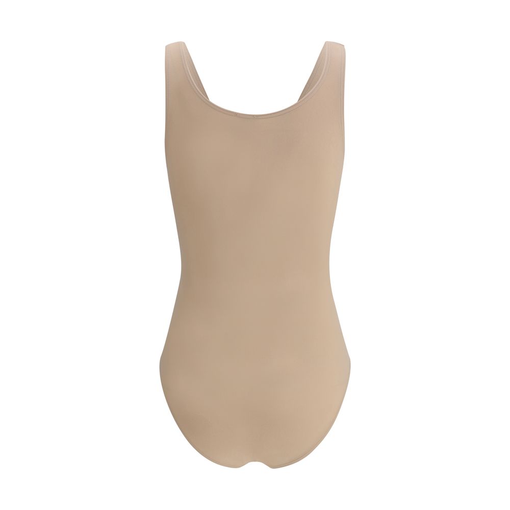 Bodysuit by Wolford for women in polyamide velvet beige showcases a flawless silhouette, elegantly defined by a refined round neckline and for a flawless and polished finish.