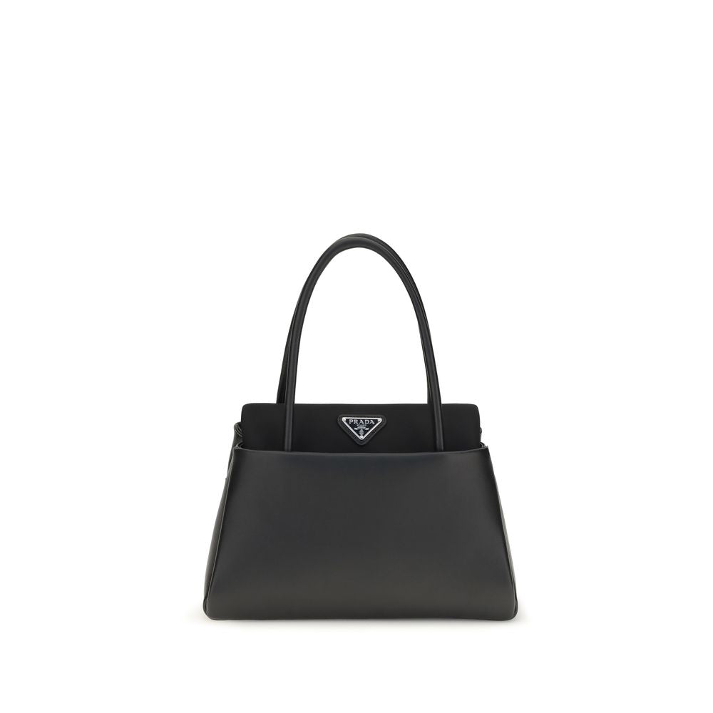 Compact Handbag by Prada for women in bos taurus calfskin leather black & signature features a contemporary silhouette, showcasing a secure , ample , and contemporary shoulder-strap, handle & detachable-strap for a sophisticated look.