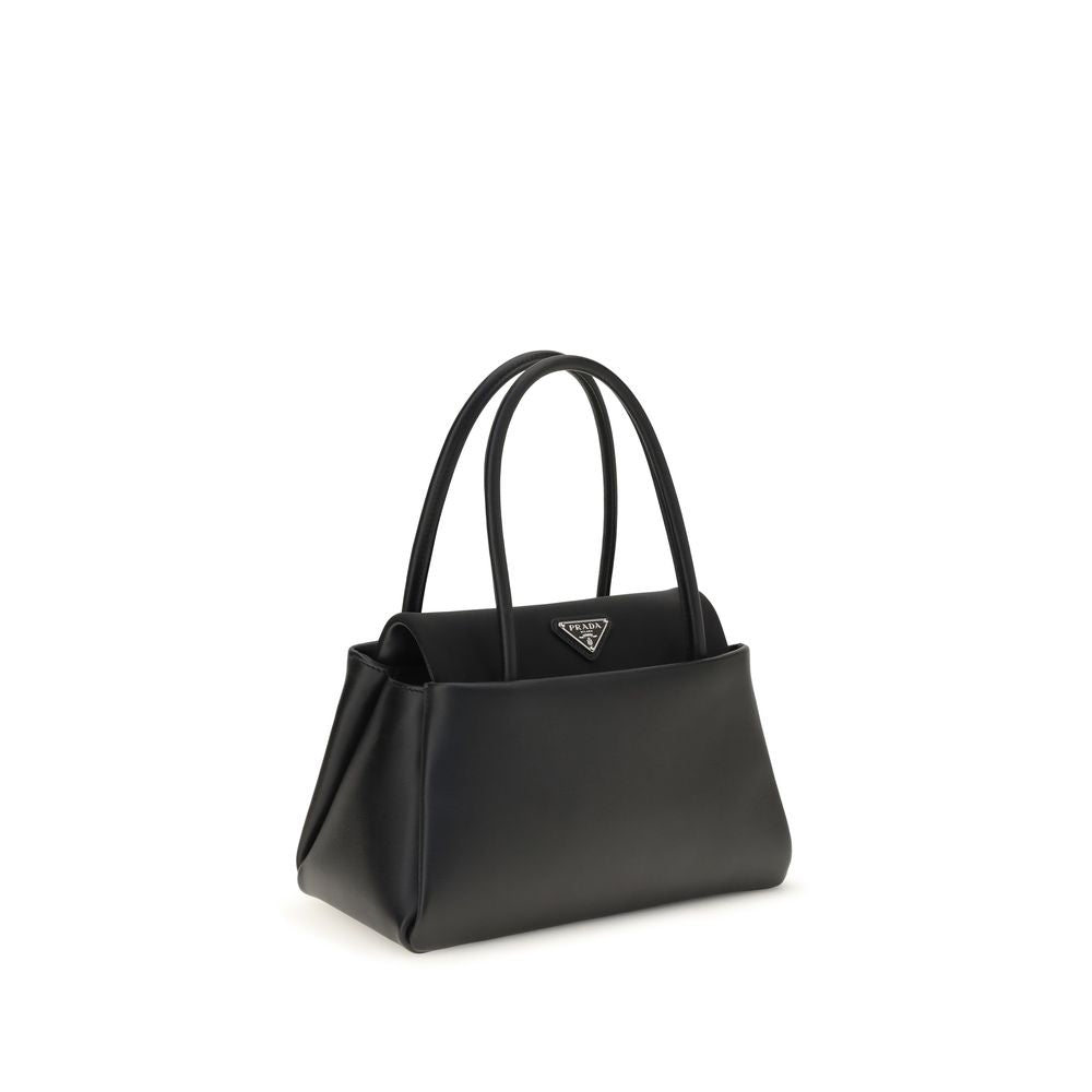 Compact Handbag by Prada for women in bos taurus calfskin leather black & signature features a signature silhouette, showcasing a secure and signature with versatile shoulder-strap, handle & detachable-strap for a sophisticated look.