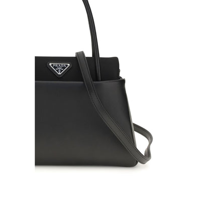 Compact Handbag by Prada for women in bos taurus calfskin leather black & signature features a refined silhouette, showcasing a secure , organized , and versatile shoulder-strap, handle & detachable-strap for a refined finish.