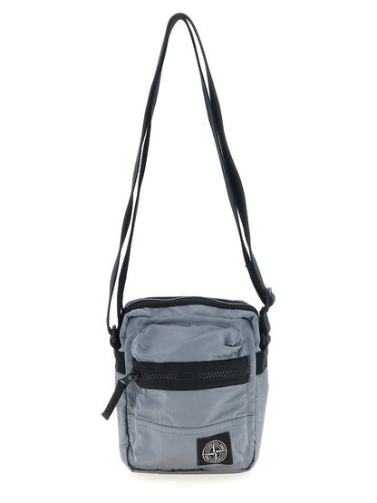 Crossbody Messenger Bag by Stone Island for men in polyamide leather gray features a statement-making Polyamide Leather Crossbody Messenger Bag design with a secure , statement-making , and versatile crossbody-strap & adjustable-strap for a sophisticated look.