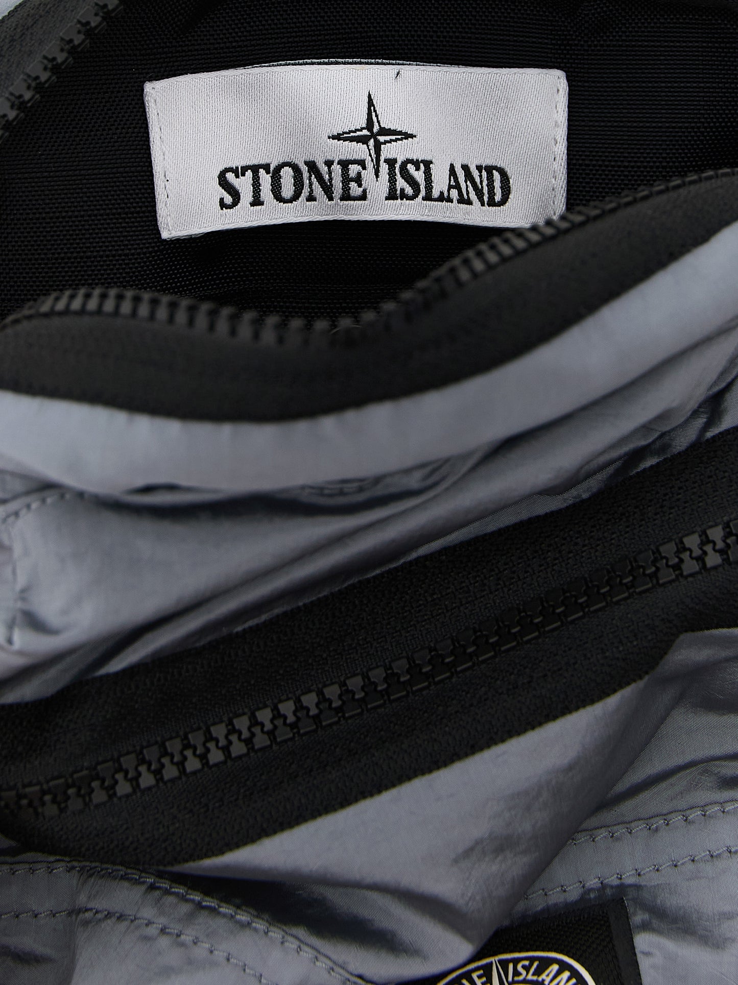 Crossbody Messenger Bag by Stone Island for men in polyamide leather gray features an versatile Polyamide Leather Crossbody Messenger Bag design with a versatile , ample , and versatile crossbody-strap & adjustable-strap for a sophisticated finish.