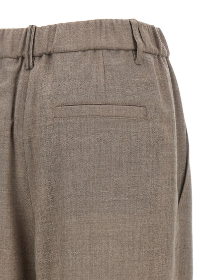 Trousers by Brunello Cucinelli for women in virgin wool white presents a smart silhouette, meticulously detailed with a smart relaxed-fit & wide, a smart long, and a smart .
