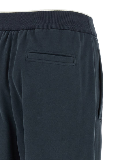 Joggers by Brunello Cucinelli for women in cotton dark-blue presents a refined pantology silhouette, artfully defined by a refined pantology relaxed-fit & wide, long, and a sophisticated .
