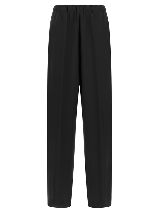 Trousers by Fabiana Filippi for women in virgin wool & polyamide black & signature features an on trend silhouette, showcasing a sophisticated relaxed-fit with a long and for an on trend finish.