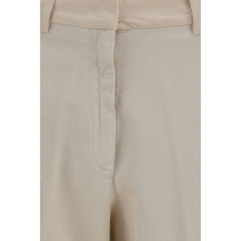 Chinos Pants by Forte_Forte for women in cotton beige features an contemporary silhouette, showcasing a sophisticated regular-fit & wide and long with a refined low rise for a truly contemporary aesthetic.