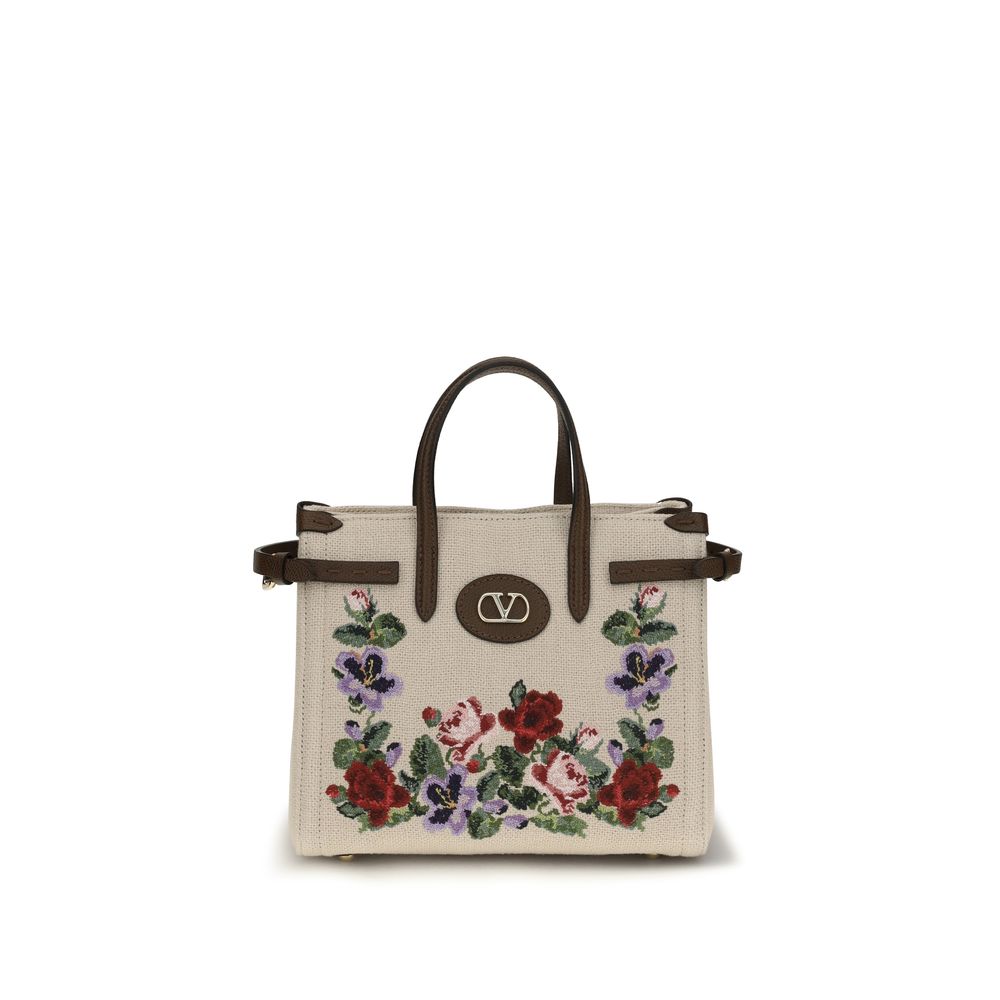Small 2-in-1 Shoulder & Crossbody Bag by Valentino Garavani for women in grained leather & linen beige, natural, floral & signature presents a versatile silhouette, showcasing a secure zipper & buckle and versatile single-compartment with versatile crossbody-strap, shoulder-strap, handle, adjustable-strap & detachable-strap for a sophisticated look.