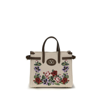 Small 2-in-1 Shoulder & Crossbody Bag by Valentino Garavani for women in grained leather & linen beige, natural, floral & signature presents a versatile silhouette, showcasing a secure zipper & buckle and versatile single-compartment with versatile crossbody-strap, shoulder-strap, handle, adjustable-strap & detachable-strap for a sophisticated look.
