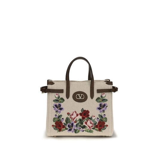Small 2-in-1 Shoulder & Crossbody Bag by Valentino Garavani for women in grained leather & linen beige, natural, floral & signature presents a versatile silhouette, showcasing a secure zipper & buckle and versatile single-compartment with versatile crossbody-strap, shoulder-strap, handle, adjustable-strap & detachable-strap for a sophisticated look.