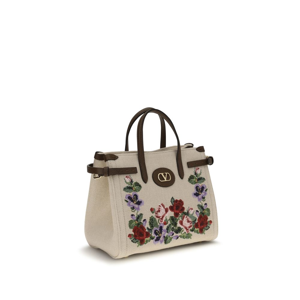 Small 2-in-1 Shoulder & Crossbody Bag by Valentino Garavani for women in grained leather & linen beige, natural, floral & signature features a distinguished silhouette, showcasing a secure zipper & buckle and distinguished single-compartment with versatile crossbody-strap, shoulder-strap, handle, adjustable-strap & detachable-strap for a distinguished finish.