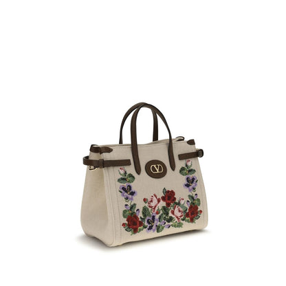 Small 2-in-1 Shoulder & Crossbody Bag by Valentino Garavani for women in grained leather & linen beige, natural, floral & signature features a distinguished silhouette, showcasing a secure zipper & buckle and distinguished single-compartment with versatile crossbody-strap, shoulder-strap, handle, adjustable-strap & detachable-strap for a distinguished finish.