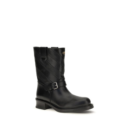 Ankle Strap Boots by Valentino Garavani for women in bos taurus calf nappa leather black & silver showcases a ergonomic silhouette from the Women's Bos Taurus Calf Nappa Leather Ankle Strap Boots collection, featuring a ergonomic and a ergonomic .