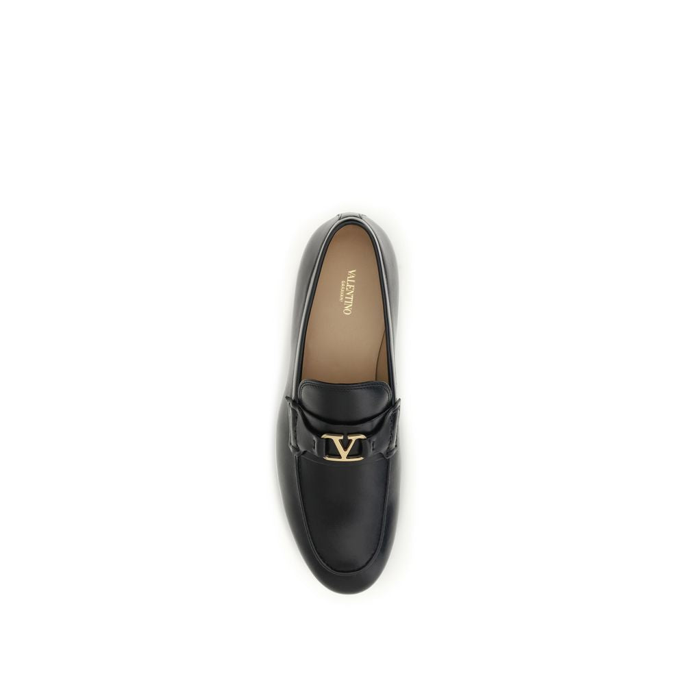 Flat Loafer Slip-On Strap Shoes by Valentino Garavani for women in bos taurus calf nappa leather black, gold & signature features an dynamic silhouette from the V Logo Women's Bos Taurus Calf Nappa Leather Flat Loafer Slip-On Strap Shoes collection, defined by a dynamic and flat for a dynamic look.