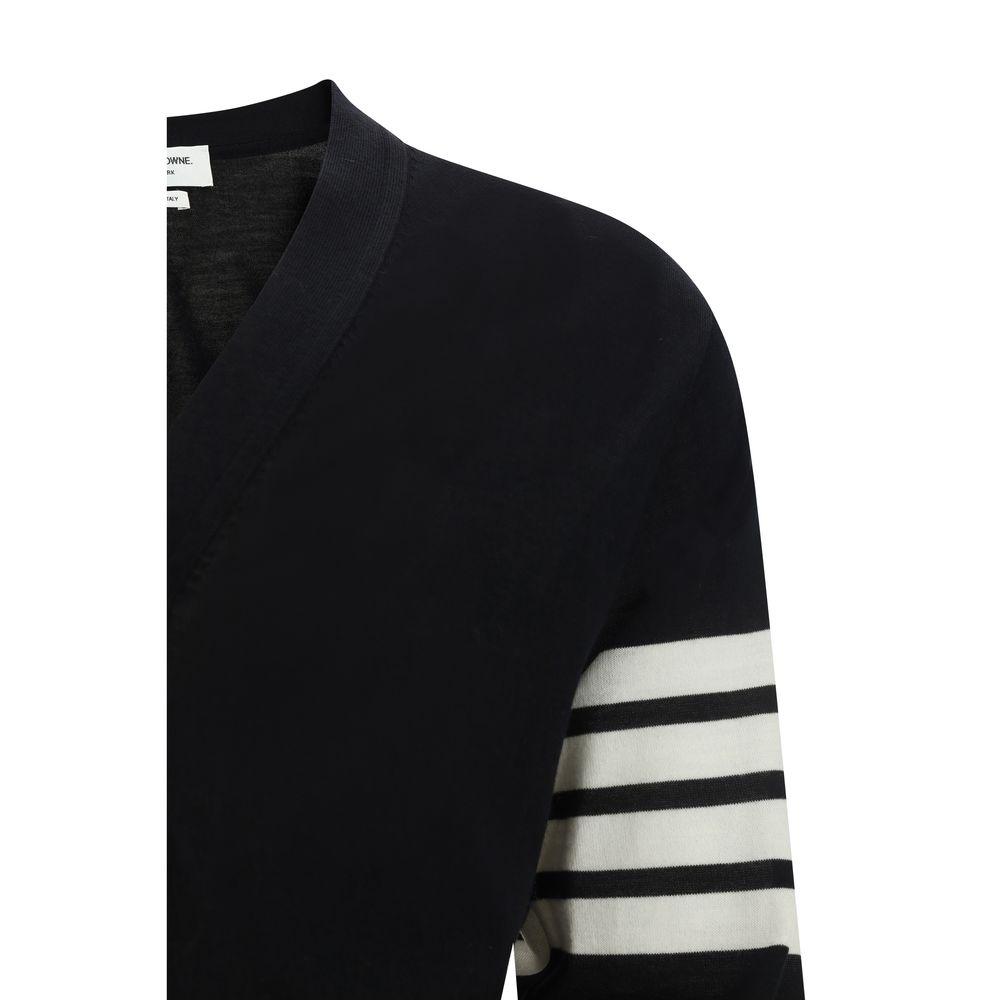 Cardigan by Thom Browne for men in virgin wool black, signature & striped features an impeccable silhouette, showcasing a sophisticated and detail for a truly impeccable finish.