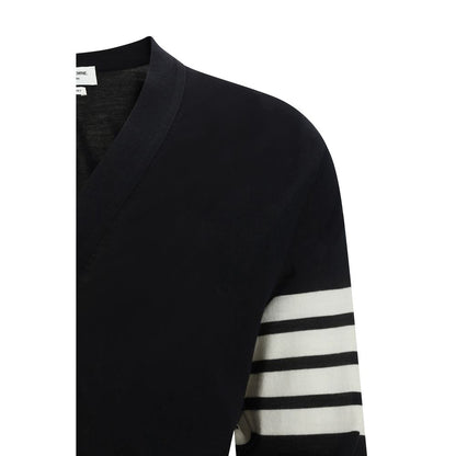 Cardigan by Thom Browne for men in virgin wool black, signature & striped features an impeccable silhouette, showcasing a sophisticated and detail for a truly impeccable finish.