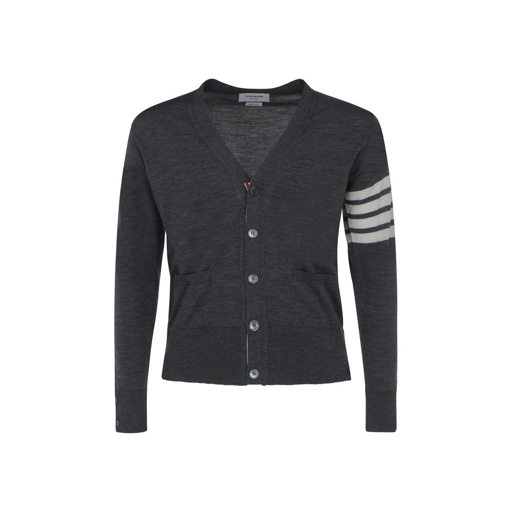 Cardigan by Thom Browne for men in virgin wool gray, signature & striped features an crisp silhouette, showcasing a sophisticated v-neck neckline and detail for a truly crisp finish.