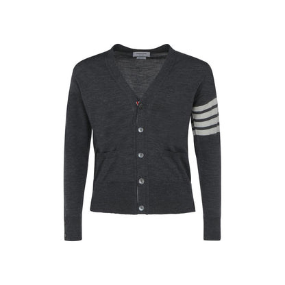 Cardigan by Thom Browne for men in virgin wool gray, signature & striped features an crisp silhouette, showcasing a sophisticated v-neck neckline and detail for a truly crisp finish.