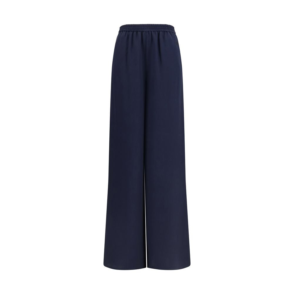 Trousers by Max Mara for women in silk blue presents a perennial silhouette, meticulously tailored with a regular-fit & wide cut, long finish, and an elegant .