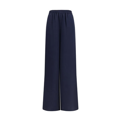 Trousers by Max Mara for women in silk blue presents a perennial silhouette, meticulously tailored with a regular-fit & wide cut, long finish, and an elegant .