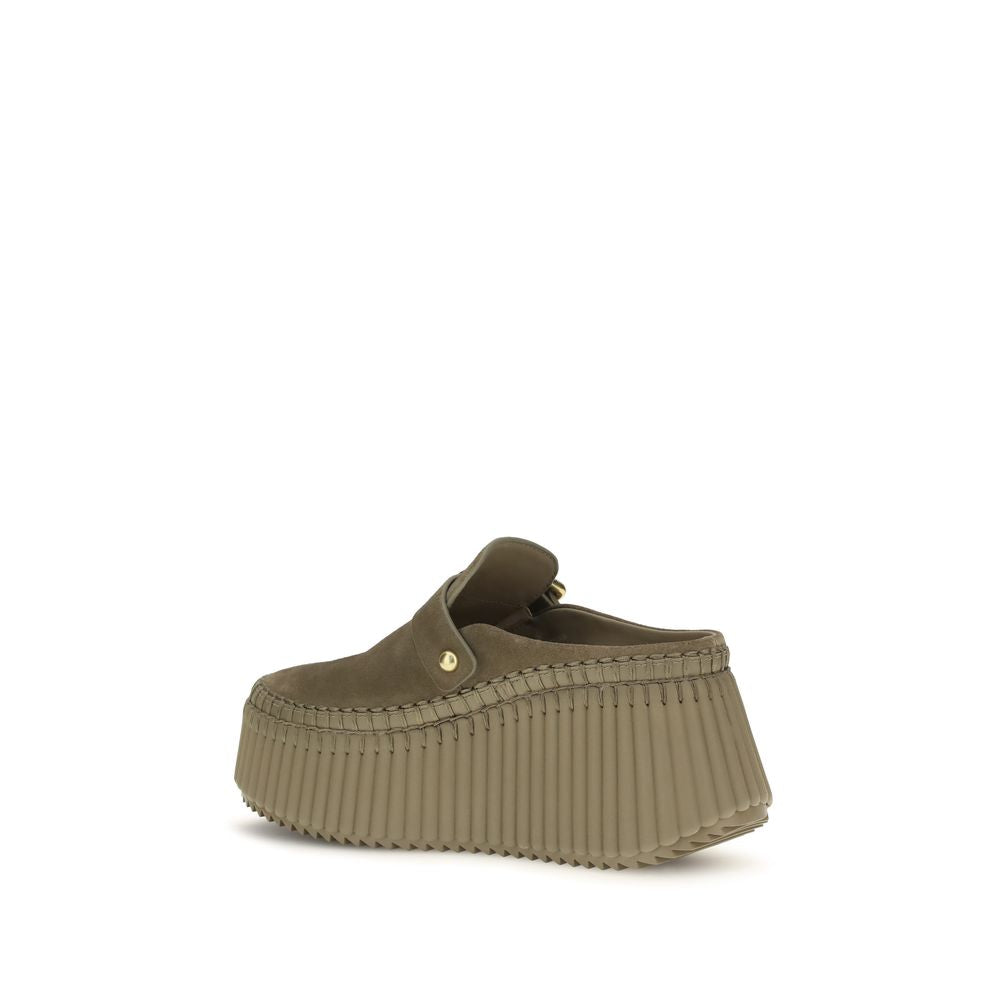 Mules Flat Shoes by Chloé for women in bos taurus calf suede leather bicolour showcases a enchanting silhouette as part of the Paddington Women's Bos Taurus Calf Suede Leather Mules Flat Shoes collection, defined by a enchanting and for a enchanting look.