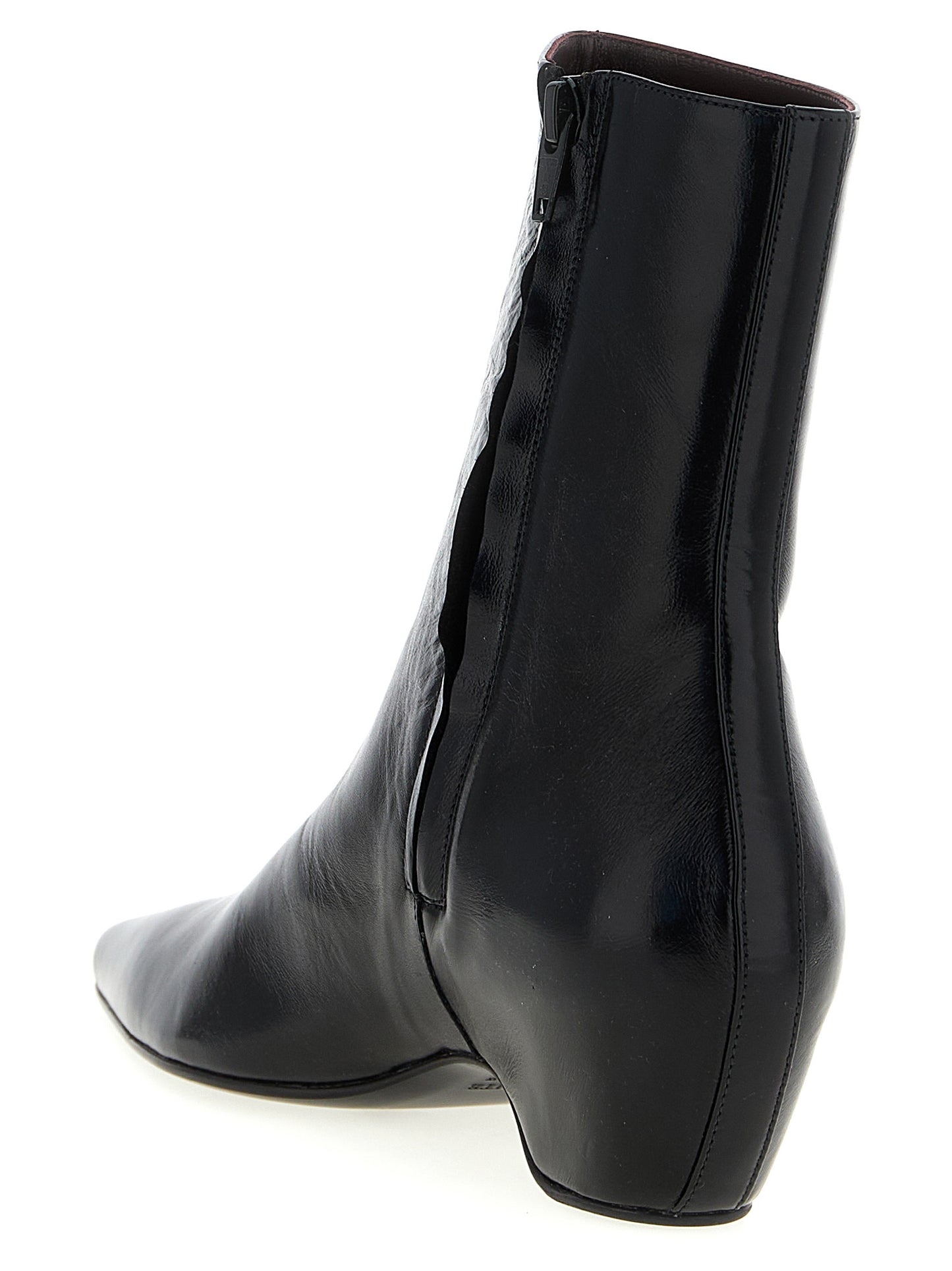 Wedge Ankle Boots by Khaite for women in calfskin leather black features an avant-garde Women's Calfskin Leather Wedge Ankle Boots silhouette, defined by a sophisticated wedge and a avant-garde pointed toe style.