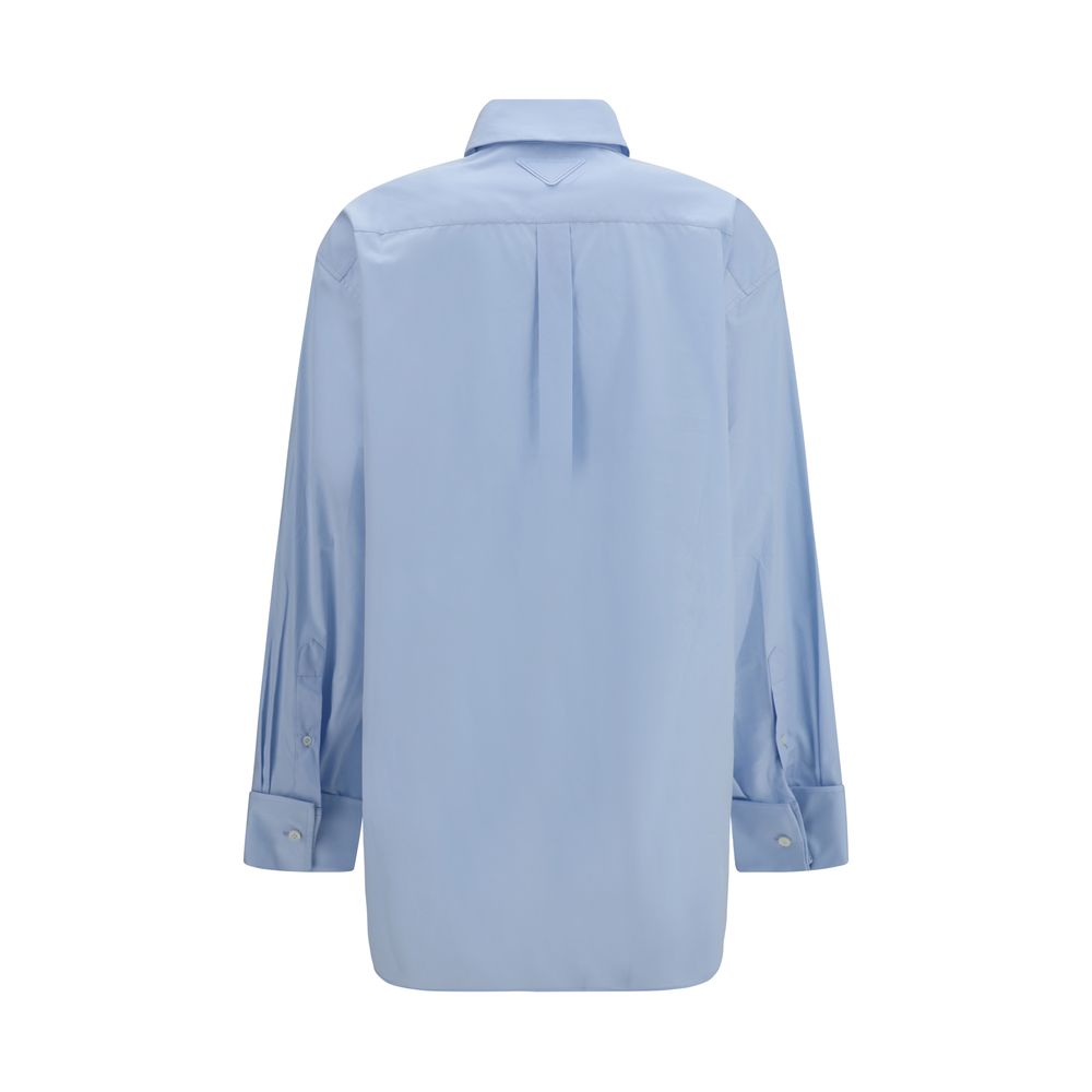 Shirt by Prada for women in cotton blue & pearl showcases a sublime silhouette, artfully detailed with a sublime and for a sophisticated, sublime finish.
