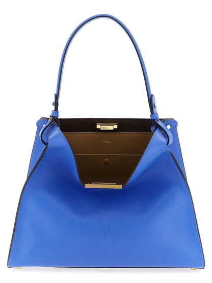 Medium Handbag by Fendi for women in calfskin leather blue & gold features a signature silhouette, showcasing a secure snap & button and signature with versatile adjustable-strap & handle for a sophisticated look.