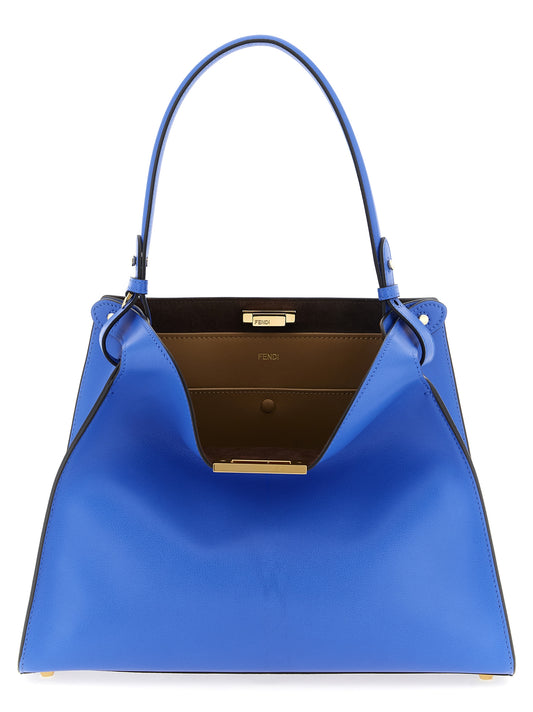 Medium Handbag by Fendi for women in calfskin leather blue & gold features a signature silhouette, showcasing a secure snap & button and signature with versatile adjustable-strap & handle for a sophisticated look.